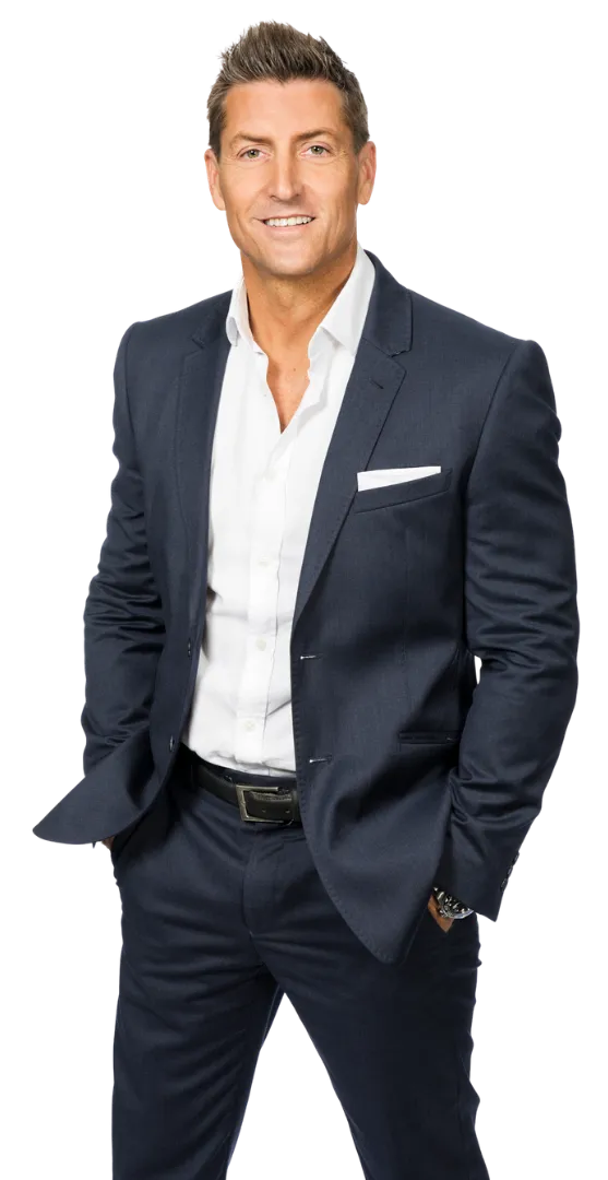 Professional man in a suit, promoting "Protect Your Assets" book.